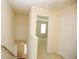 Upstairs landing with a view into another room at 988 Vintage Pointe Dr, Lawrenceville, GA 30044