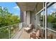 Comfortable outdoor balcony with patio furniture and tree view, perfect for relaxing at 130 Arizona Ne Ave # 214, Atlanta, GA 30307