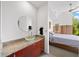 Bathroom featuring granite countertops, glass bowl sink, and bedroom view at 130 Arizona Ne Ave # 214, Atlanta, GA 30307