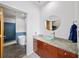 Bathroom featuring granite countertops, glass bowl sink, and blue tiled shower with tub at 130 Arizona Ne Ave # 214, Atlanta, GA 30307