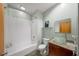 Well-lit bathroom featuring a tub with a shower, a granite countertop and a glass vessel sink at 130 Arizona Ne Ave # 214, Atlanta, GA 30307