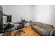 Bonus room featuring hardwood floors, modern design table, and futon at 130 Arizona Ne Ave # 214, Atlanta, GA 30307
