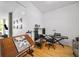 Bonus room featuring hardwood floors and a modern design table and keyboard at 130 Arizona Ne Ave # 214, Atlanta, GA 30307