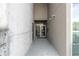 Building entryway with glass doors, gray walls, concrete floors and modern lighting at 130 Arizona Ne Ave # 214, Atlanta, GA 30307
