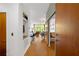 Hallway with hardwood floors and a barn door leading to an open concept living and dining area at 130 Arizona Ne Ave # 214, Atlanta, GA 30307