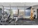 Bright gym featuring a variety of exercise equipment and weights with a view of the outdoors at 130 Arizona Ne Ave # 214, Atlanta, GA 30307