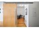 Hallway with sliding wood door leading to bonus room or den at 130 Arizona Ne Ave # 214, Atlanta, GA 30307