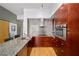 Modern kitchen showcasing granite counters, sleek cabinetry, and stainless-steel appliances at 130 Arizona Ne Ave # 214, Atlanta, GA 30307
