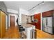 Modern kitchen with stainless steel appliances, granite countertops, and seating at the bar at 130 Arizona Ne Ave # 214, Atlanta, GA 30307