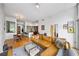 Open living room featuring a leather sofa, hardwood floors, and modern decor with eat-in kitchen in background at 130 Arizona Ne Ave # 214, Atlanta, GA 30307
