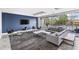 Comfortable lounge with modern gray couches, chairs, and floor to ceiling windows overlooking a pool at 130 Arizona Ne Ave # 214, Atlanta, GA 30307