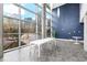 Bright lounge area with floor to ceiling windows, a long table, and modern décor at 130 Arizona Ne Ave # 214, Atlanta, GA 30307