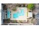 Aerial view of a community pool area, featuring multiple pools, seating, and parking at 130 Arizona Ne Ave # 214, Atlanta, GA 30307