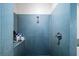 Close-up of walk-in shower tiled in blue mosaic tile at 130 Arizona Ne Ave # 214, Atlanta, GA 30307