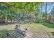 Sprawling backyard with lush greenery, shade trees, and space for outdoor activities at 1461 Sanden Ferry Dr, Decatur, GA 30033