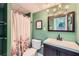 Bathroom with floral shower curtain, traditional vanity, and ample space at 1461 Sanden Ferry Dr, Decatur, GA 30033