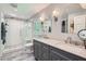 Renovated bathroom with double vanity, modern fixtures, and a glass-enclosed shower at 1461 Sanden Ferry Dr, Decatur, GA 30033