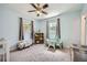 Brightly lit bedroom with neutral carpet, playful decor, and ample space at 1461 Sanden Ferry Dr, Decatur, GA 30033