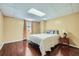 Cozy bedroom features natural light, wood floors, and comfortable accommodations at 1461 Sanden Ferry Dr, Decatur, GA 30033