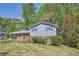 Well-maintained two-story home featuring light blue siding, brick accents, and a lush green lawn at 1461 Sanden Ferry Dr, Decatur, GA 30033