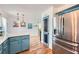 The kitchen with painted cabinets, stainless steel appliances, white countertops, and hardwood floors opens to a breakfast nook at 1461 Sanden Ferry Dr, Decatur, GA 30033