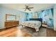 Bright main bedroom with hardwood floors, stylish geometric wall design, and ample natural light at 1461 Sanden Ferry Dr, Decatur, GA 30033