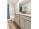 Bathroom features a dual sink vanity with granite countertops, tub and shower at 149 Weldon Rd, Mcdonough, GA 30253