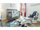 Cozy bedroom features a gray crib, glider chair, and colorful rug at 149 Weldon Rd, Mcdonough, GA 30253