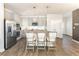 Stylish kitchen featuring stainless steel appliances, bar seating, and modern finishes at 149 Weldon Rd, Mcdonough, GA 30253