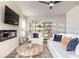 Cozy living room featuring a plush sofa, stylish decor, and a modern fireplace at 149 Weldon Rd, Mcdonough, GA 30253