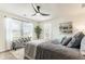 Serene main bedroom with a large window, sitting bench, and comfortable bedding at 149 Weldon Rd, Mcdonough, GA 30253