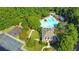 Aerial shot of the community amenities including a pool, playground and clubhouse with parking at 1549 Tappahannock Trl, Marietta, GA 30062