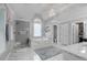 Luxurious bathroom featuring a soaking tub, walk-in shower, and elegant tile work at 1549 Tappahannock Trl, Marietta, GA 30062
