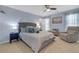Comfortable bedroom with blue walls, plush carpeting, and a cozy seating area at 1549 Tappahannock Trl, Marietta, GA 30062