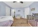 Spacious Bedroom featuring hardwood floors, two cribs, and a walk-in closet at 1549 Tappahannock Trl, Marietta, GA 30062