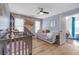 Charming Bedroom with two cribs, hardwood floors, and a cozy play area at 1549 Tappahannock Trl, Marietta, GA 30062