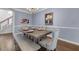 Formal dining room featuring elegant decor, hardwood floors, stylish chandelier, and seating for six at 1549 Tappahannock Trl, Marietta, GA 30062