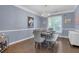 Formal dining room featuring elegant decor, hardwood floors, stylish chandelier, and seating for six at 1549 Tappahannock Trl, Marietta, GA 30062