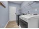 Functional laundry room with modern washer and dryer, ample storage, and clean design at 1549 Tappahannock Trl, Marietta, GA 30062
