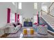 Bright, open living room with tall ceilings, large windows, hardwood floors, and stylish decor at 1549 Tappahannock Trl, Marietta, GA 30062