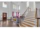 Bright, open living room with tall ceilings, large windows, hardwood floors, and stylish decor at 1549 Tappahannock Trl, Marietta, GA 30062