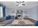 Inviting living room with fireplace, decor, large sectional, and beautiful hardwood floors at 1549 Tappahannock Trl, Marietta, GA 30062