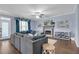 Spacious living room with large sectional sofa, fireplace, ceiling fan and plenty of natural light at 1549 Tappahannock Trl, Marietta, GA 30062