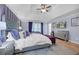 Serene main bedroom with purple accents, hardwood floors, and a comfortable seating area at 1549 Tappahannock Trl, Marietta, GA 30062