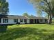 Charming home with a covered front porch and a well-maintained lawn at 2085 Jones Phillips Rd, Dacula, GA 30019