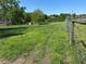 Fenced pasture with lush greenery, offering a serene rural setting at 2085 Jones Phillips Rd, Dacula, GA 30019