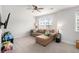 Cozy bonus room with plush carpeting, large window, and a comfortable sectional sofa for relaxation at 214 Gaston Ct, Canton, GA 30115