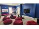 Community game room with large TV screens, beanbag chairs, and comfortable seating at 214 Gaston Ct, Canton, GA 30115
