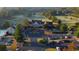 An aerial of the golf course and country club, with a parking lot, and circular driveway at 214 Gaston Ct, Canton, GA 30115