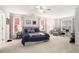 Spacious main bedroom with soft carpeting, multiple windows, and a comfortable bed with stylish decor at 214 Gaston Ct, Canton, GA 30115